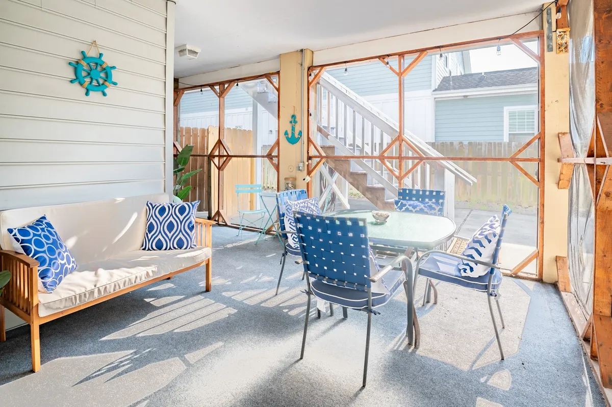 A bright and cheerful dining area with blue decor accents, comfortable seating, and a welcoming table setting. The space is designed for casual dining, social gatherings, and relaxation—ideal for families and groups planning local outings.